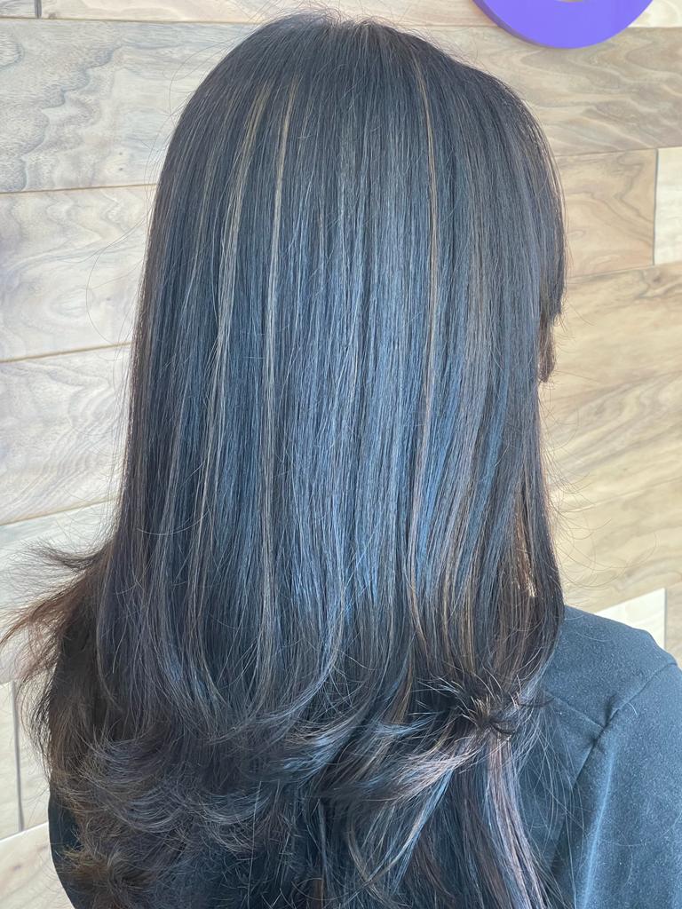 Deep blue hair color transformation with cruelty-free hair dye at Bijal Beauty Salon